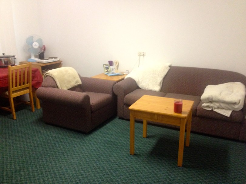 The living room area - the white walls have started to get to me a bit. Thankfully, we have plenty of photographs to spruce up the walls and Shutterfly is surprisingly efficient at getting ordered items here quickly. The white walls should be covered soon!