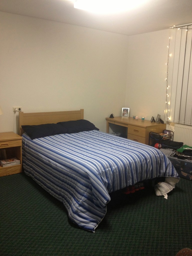 Our bedroom! I remember walking in the bedroom and laughing at how small the bed was - but again, it works! Although I am very excited for the day that I get to sleep in our king-size bed again! :-)