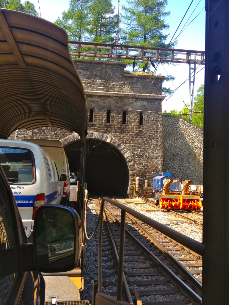 Sitting in our car as the train takes us to the next drivable road!