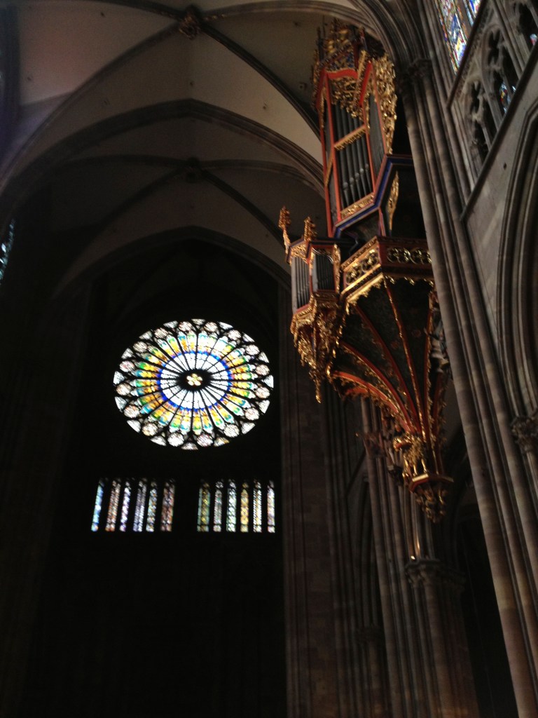 The gorgeous stained glass and the impressive organ pipes
