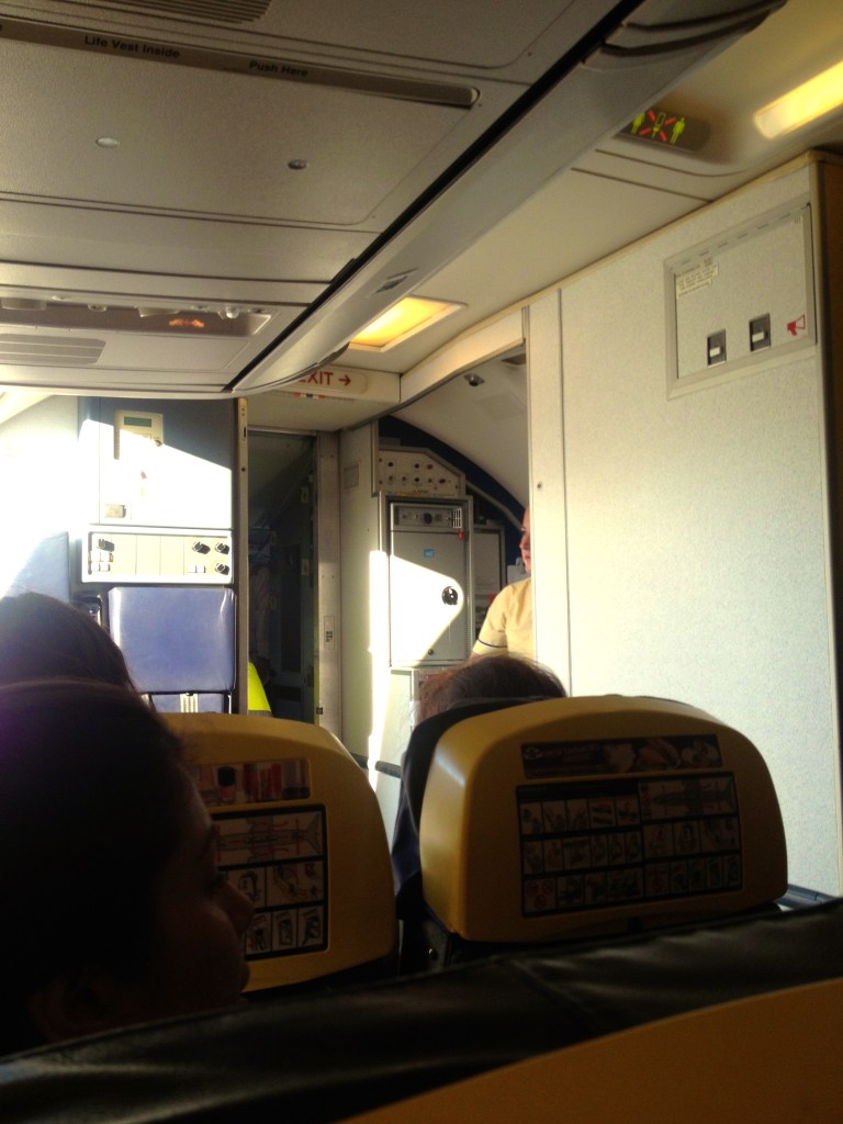 If you look close, you will see the cock-pit door open. Pretty unheard of in the states, but the pilot door remains open until just before take-off!