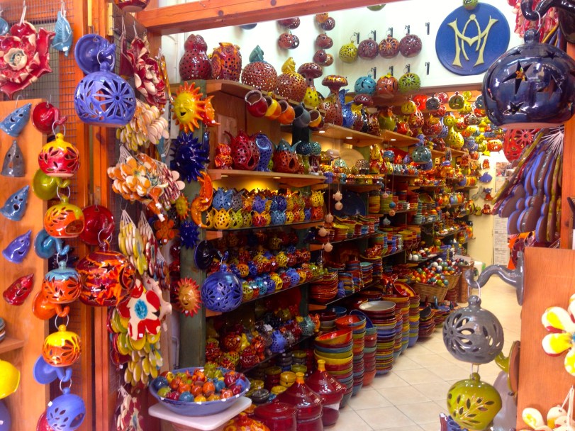 I adored the pottery and had a hard time picking out a piece. Luckily John helped, and one of these definitely made it back with us!