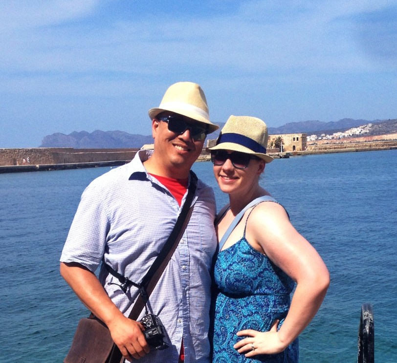 John and I by the harbor (with our hats, bought from one of the markets!)