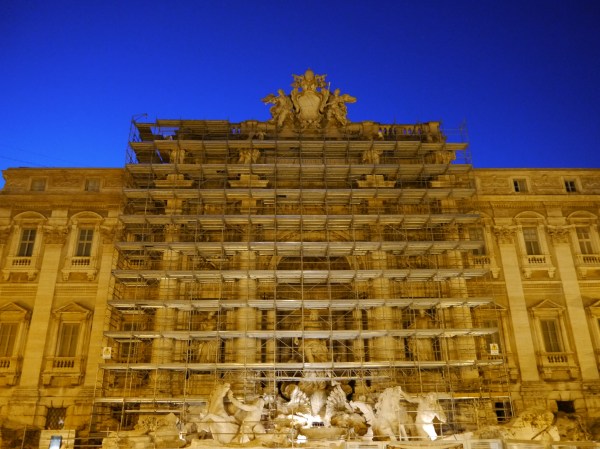 Behind the scaffolding is the Trevi Fountain.