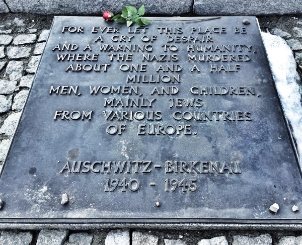 There is one of these plaques written in each language of the known victims - 27 total - and placed at the end of the railroad tracks.