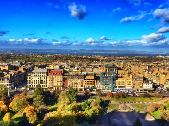 The view of Edinburgh's "New Town," and the ocean behind it.