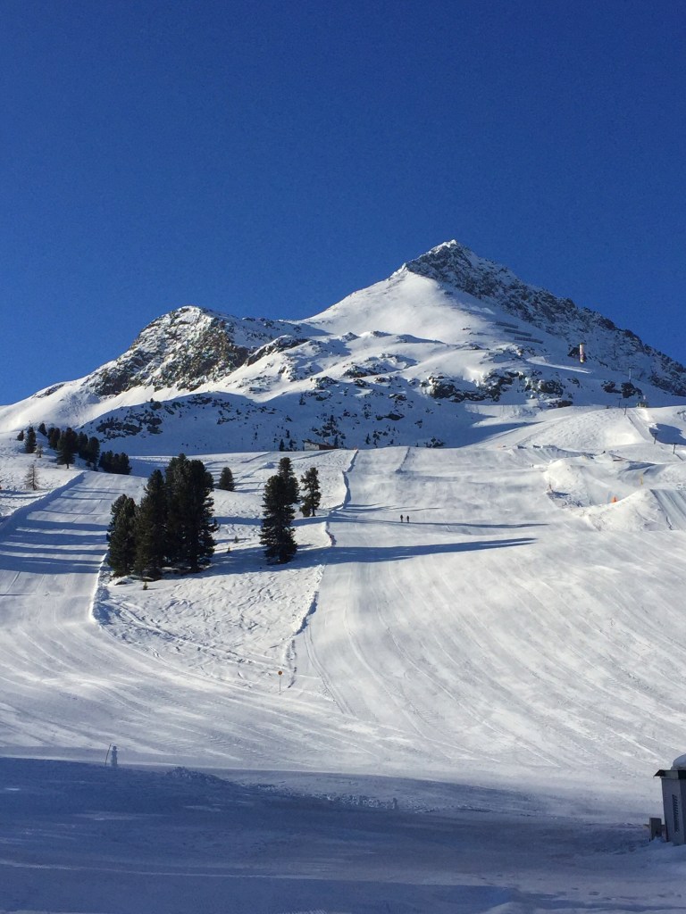 The ski slopes next to the igloos.
