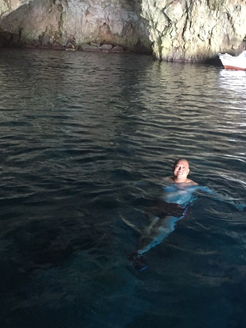John swimming in the cave.